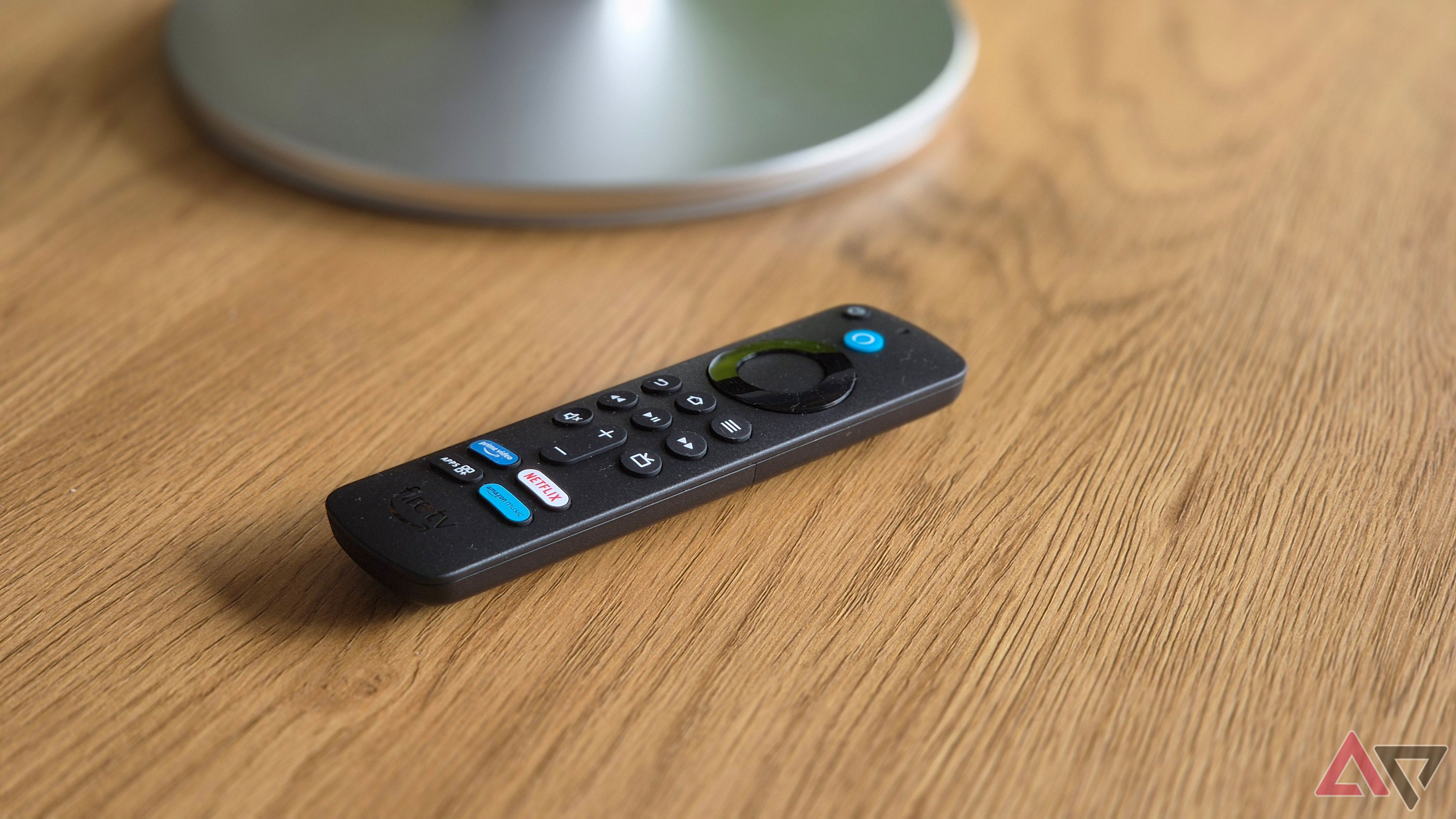 Amazon Echow Show 21 Fire TV Remote on wooden surface