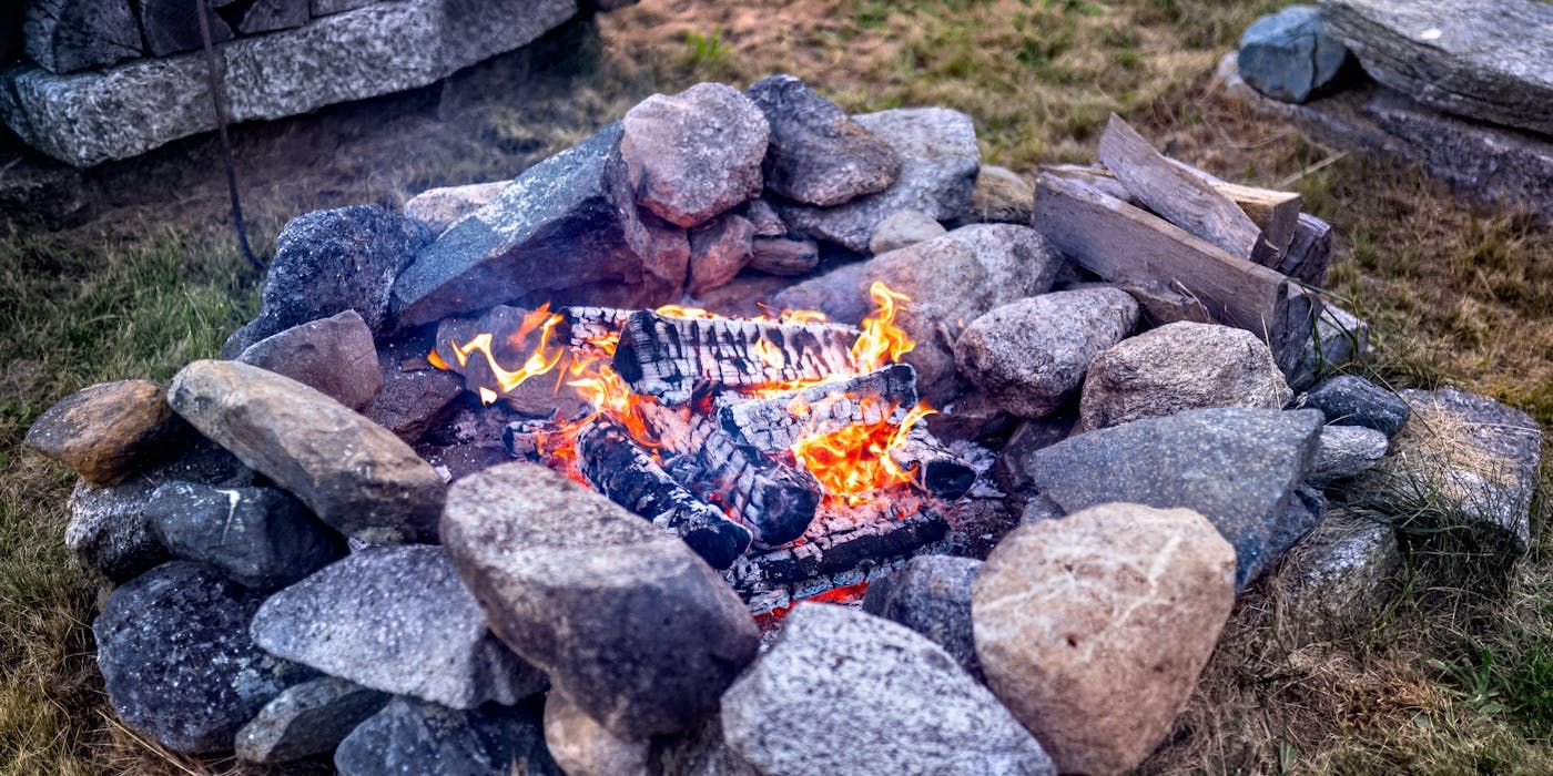 fire burning in a rock fire pit