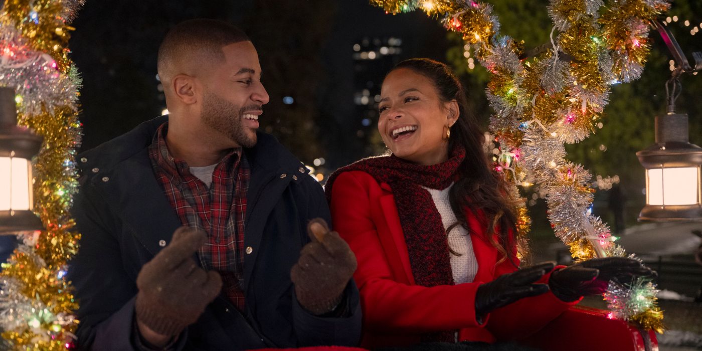 Teddy (Devale Ellis) and Layla (Christina Milian) laugh on a carriage ride in Meet Me Next Christmas