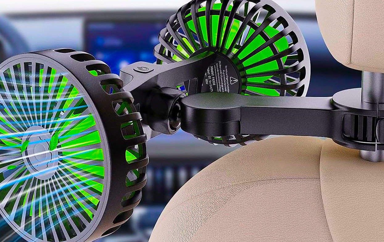 A dual-blade USB car fan mounted on the back of a front seat headrest.