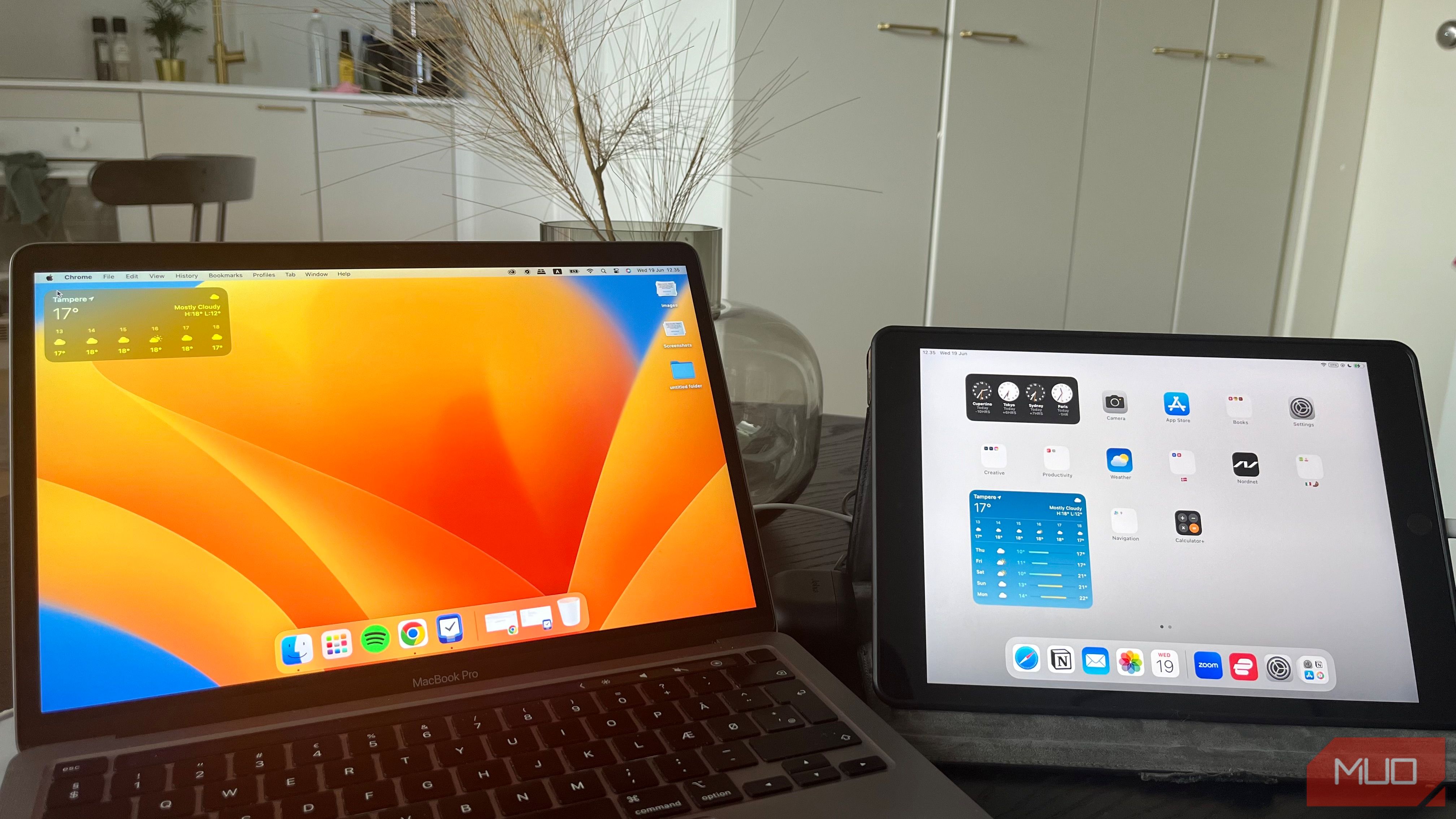 a MacBook and iPad next to each other on a desk