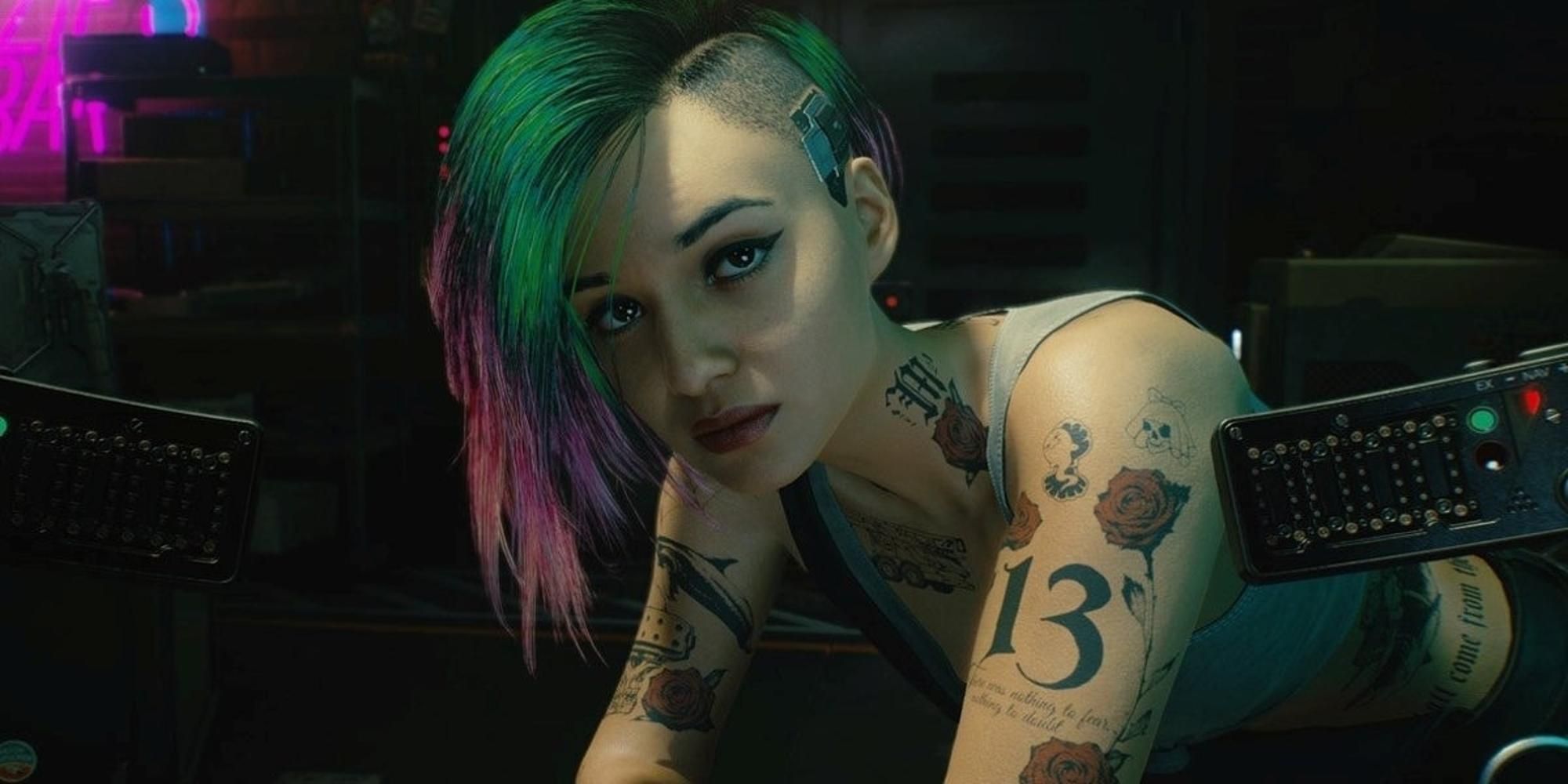 A close up shot of Judy in Cyberpunk 2077