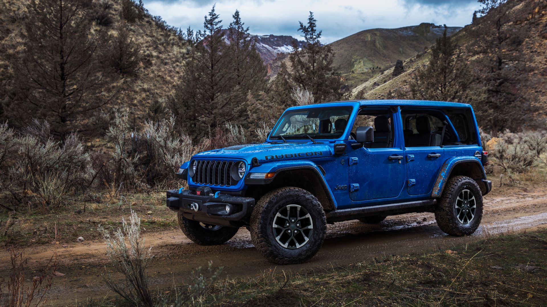 2025 Jeep Wrangler Rubicon X 4xe Blue Front Angle Off-Road