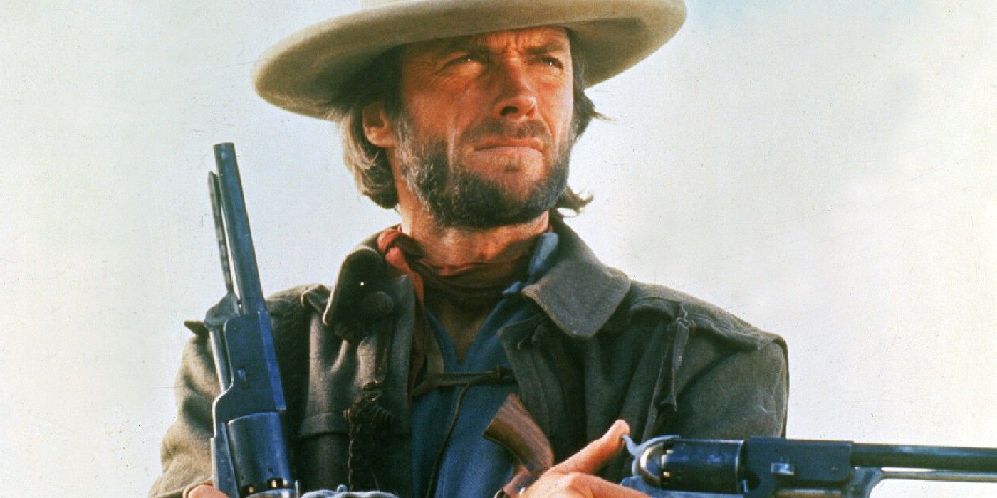 Clint Eastwood as Josey Wales brandishes his guns In The Outlaw Josey Wales.