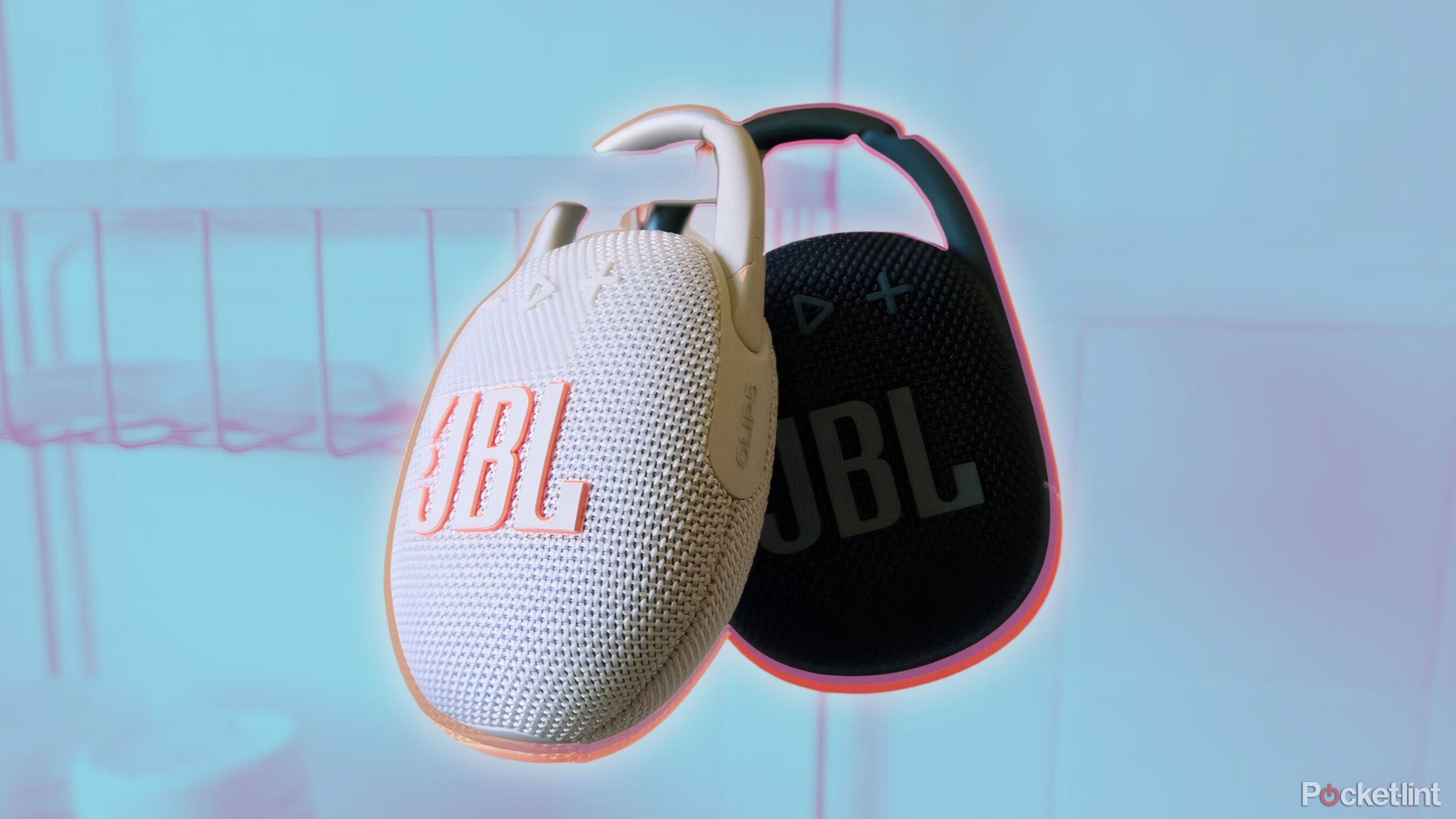 A JBL Clip 5 hanging in front of a JBL Clip 4 in a shower.