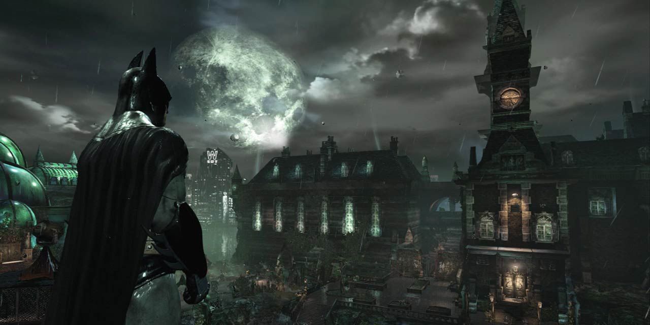 Batman gazing out over Arkham Asylum on a cloudy moonlight night.