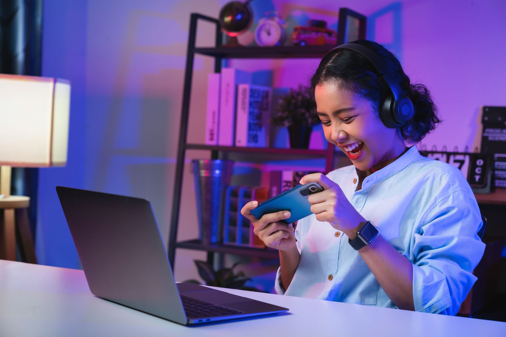 a young woman gaming on her smartphone