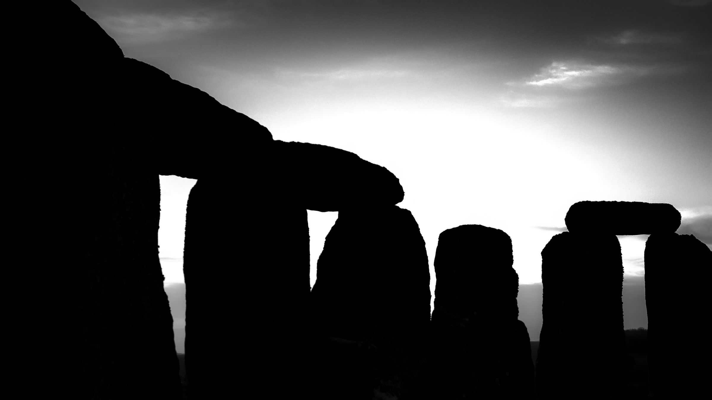 Stonehenge silhouette at sunrise in black and white