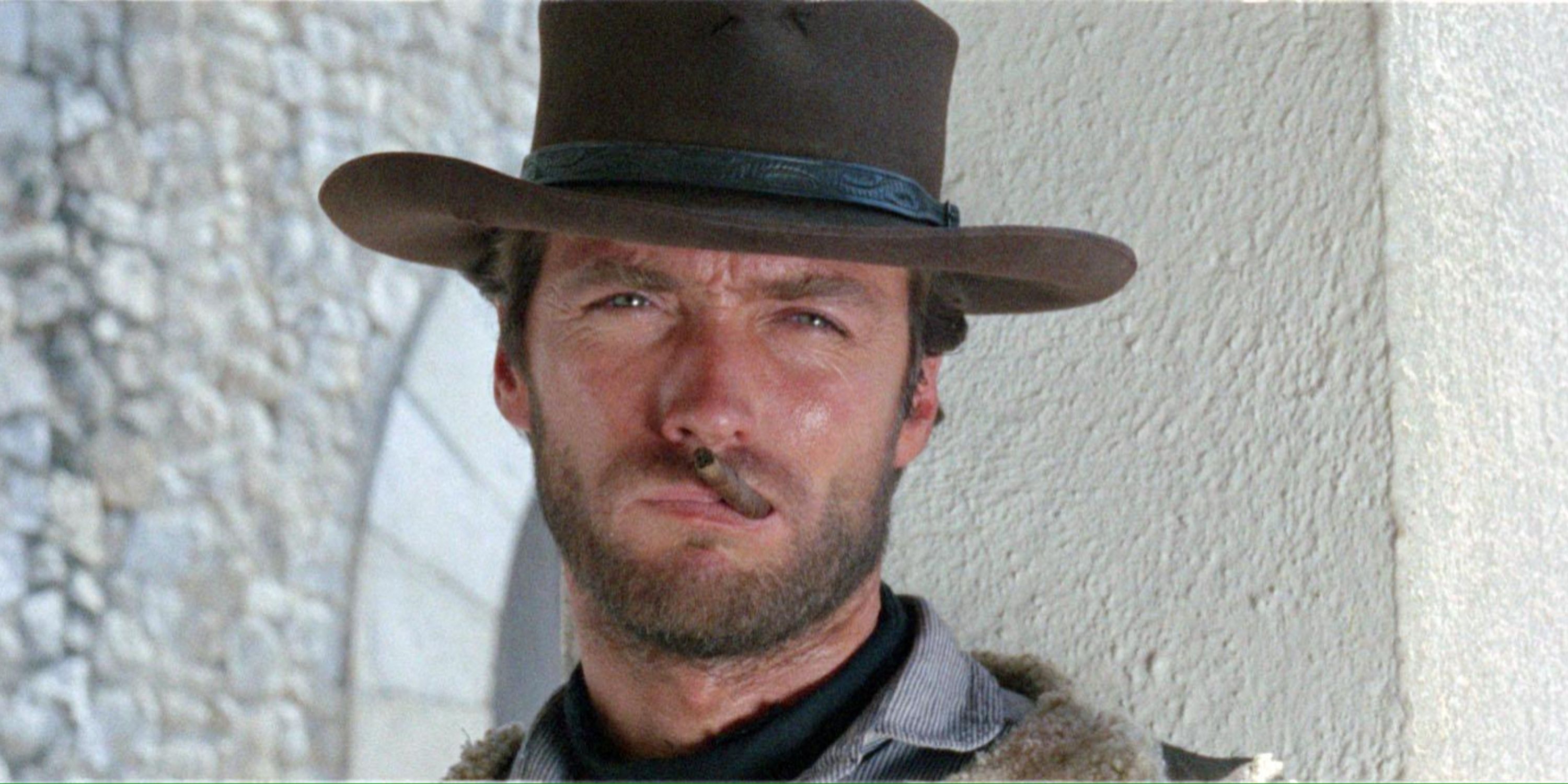 Clint Eastwood smokes a cigar in A Fistful of Dollars