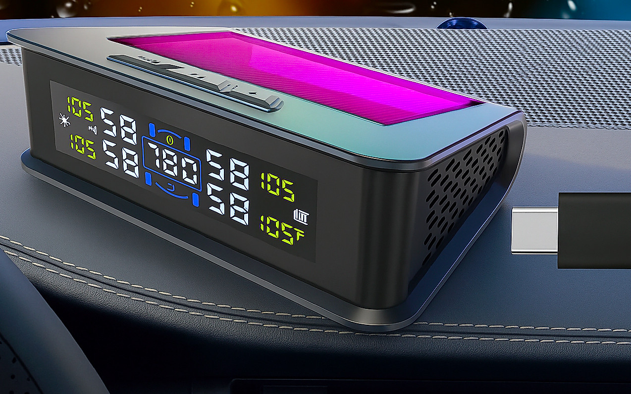 A digital car display with a USB cable beside it.