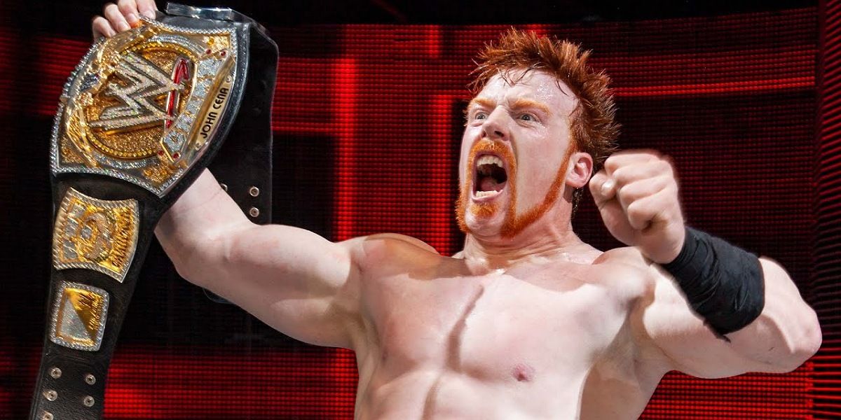 Sheamus holding the WWE Championship. 