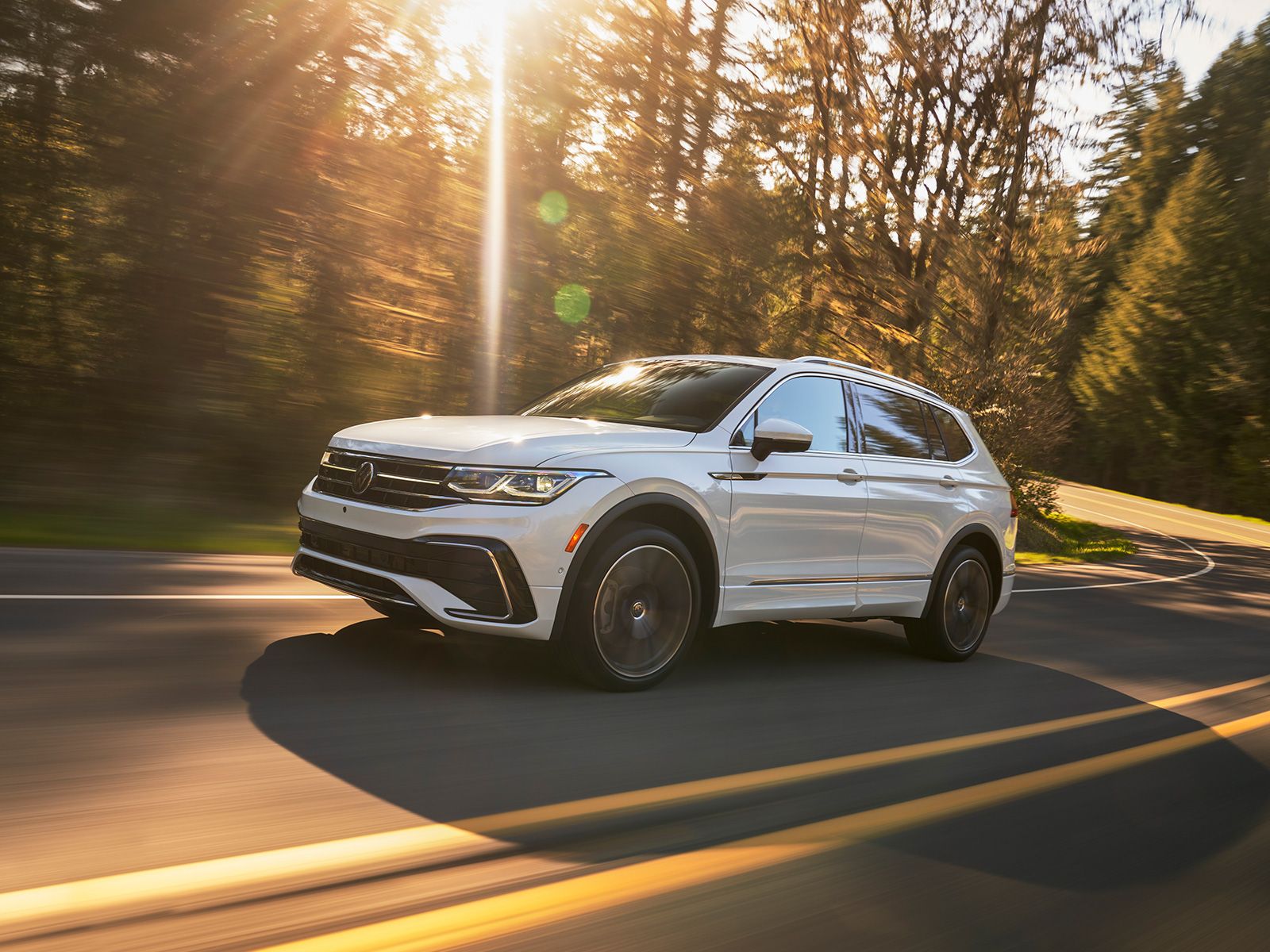 A driving 2023 Volkswagen Tiguan