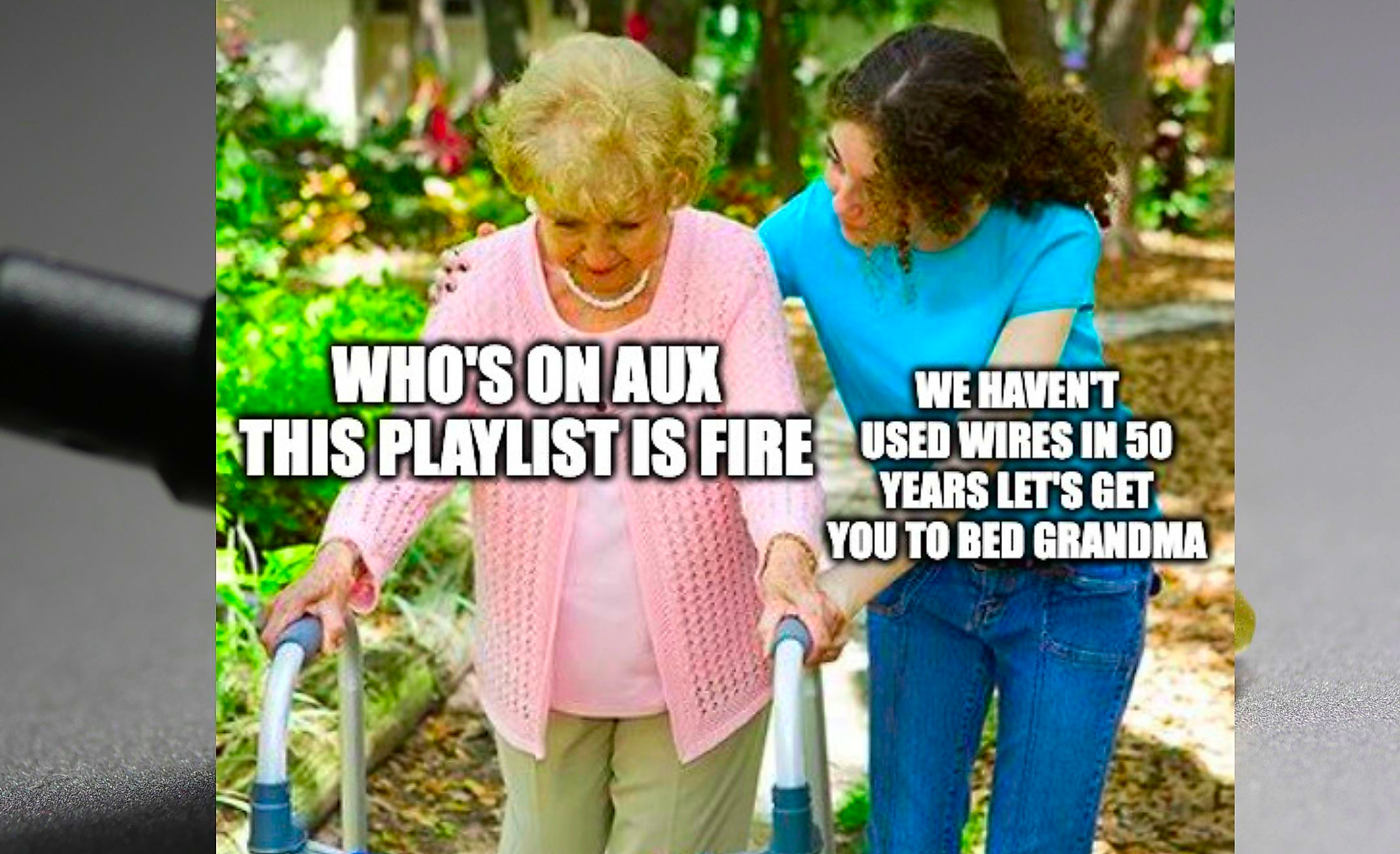 A grandmother being pushed by her granddaughter.