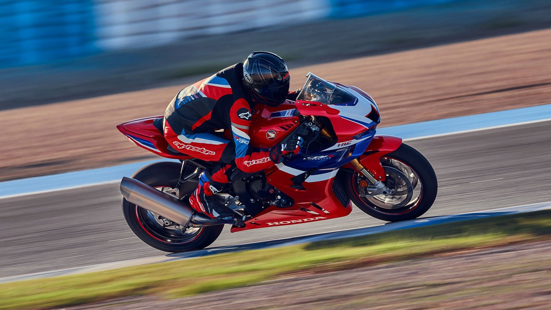 2025 Honda CBR1000RR-R Fireblade SP front fascia cornering on racetrack hd wallpaper