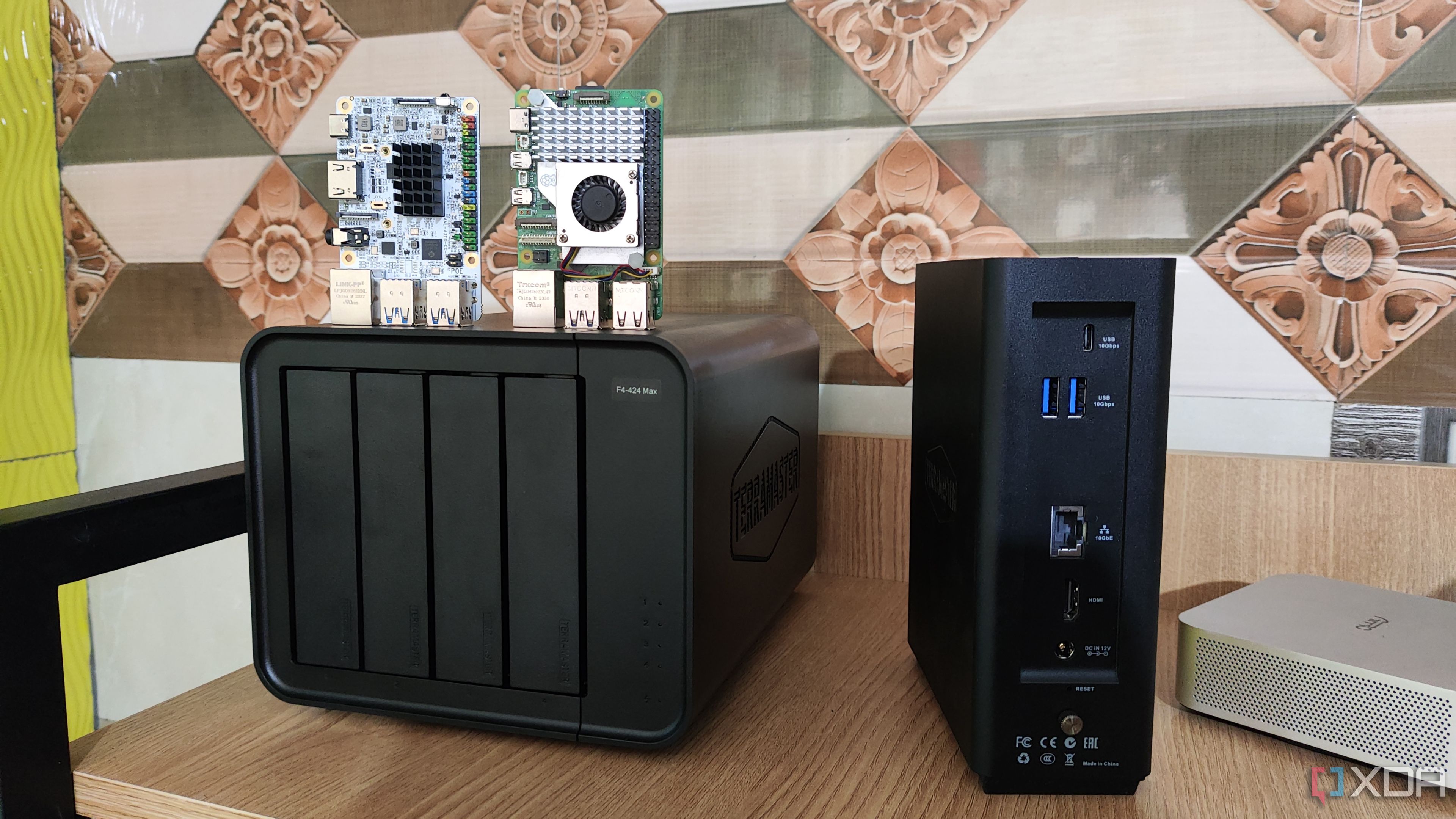 A Raspberry Pi 5 and Libre Computer Alta placed on top of a TerraMaster F4 424 Pro NAS